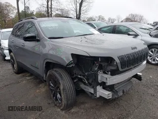 2023 Jeep Cherokee Altitude Lux with VIN 1C4PJMMB8PD114958, listed as a IAAI auction lot 41862302 with 64,341 mi miles. Bid and sale history available at carsss.com. Image 1.