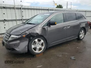 2012 Honda Odyssey Touring with VIN 5FNRL5H94CB109257, listed as a Copart auction lot 59636075 with 107,543 mi miles and Salvage title. Bid and sale history available at DreamBid. Image 1.