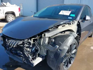 2018 Tesla Model 3 Long Range Battery with VIN 5YJ3E1EA8JF010834, listed as a IAAI auction lot 41598099 with 83,252 mi miles. Bid and sale history available at carsss.com. Image 6.