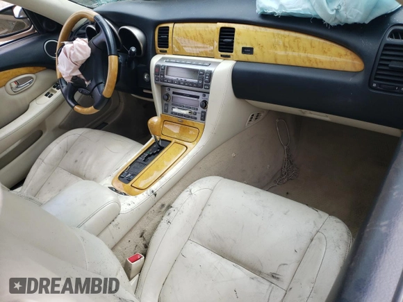 2002 Lexus SC 430 with VIN JTHFN48Y320010682, listed as a Copart auction lot 60476285 with 198,630 mi miles and Salvage title. Bid and sale history available at DreamBid. Image 8.