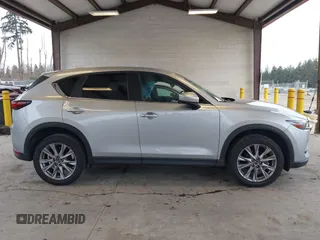 2020 Mazda CX-5 Grand Touring with VIN JM3KFADM0L0738693, listed as a IAAI auction lot 41725906 with 63,629 mi miles. Bid and sale history available at carsss.com. Image 14.