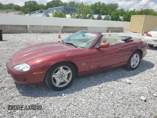 1999 Jaguar XK z VIN SAJGX2040XC032272, wystawiony jako Copart lot #58531915 z przebiegiem 41 490 mil mil oraz Szkody całkowita. Historia ofert i sprzedaży dostępna na DreamBid. Obrazek 1.