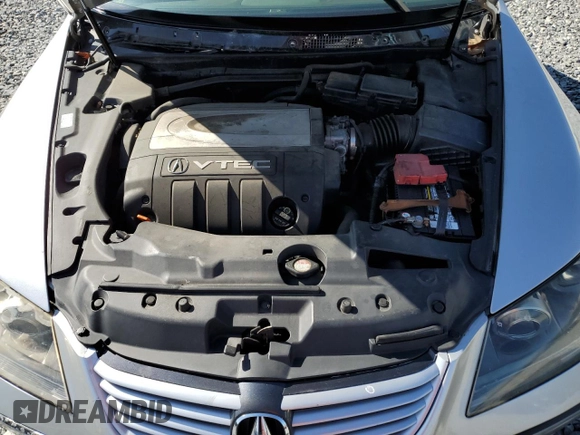 2005 Acura RL z VIN JH4KB165X5C014519, wystawiony jako Copart lot #63648925 z przebiegiem 215 443 mil mil oraz Nie do naprawy • Non repairable. Historia ofert i sprzedaży dostępna na DreamBid. Obrazek 11.