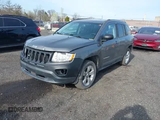2013 Jeep Compass Latitude with VIN 1C4NJDEB7DD261645, listed as a IAAI auction lot 41948272 with 86,008 mi miles. Bid and sale history available at carsss.com. Image 2.
