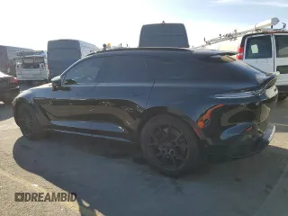2021 Aston Martin DBX z VIN SCFVUJAWXMTV01292, wystawiony jako Copart lot #83824504 z przebiegiem Nie podano mil oraz Szkody całkowita. Historia ofert i sprzedaży dostępna na DreamBid. Obrazek 2.