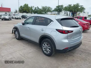 2023 Mazda CX-5 S Carbon Edition z VIN JM3KFBCM3P0197796, wystawiony jako IAAI lot #42408301 z przebiegiem 46 169 mil mil oraz . Historia ofert i sprzedaży dostępna na DreamBid. Obrazek 3.