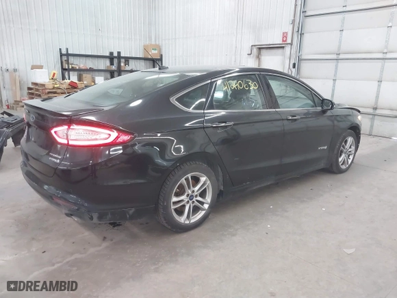 2015 Ford Fusion Titanium Hybrid with VIN 3FA6P0RU2FR309074, listed as a IAAI auction lot 41240630 with 172,025 mi miles. Bid and sale history available at carsss.com. Image 4.