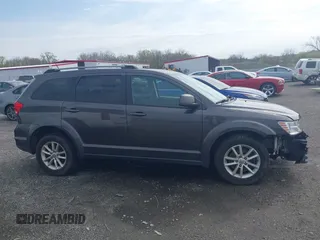 2017 Dodge Journey SXT with VIN 3C4PDDBG5HT618563, listed as a IAAI auction lot 42015188 with 104,747 mi miles and . Bid and sale history available at DreamBid. Image 13.