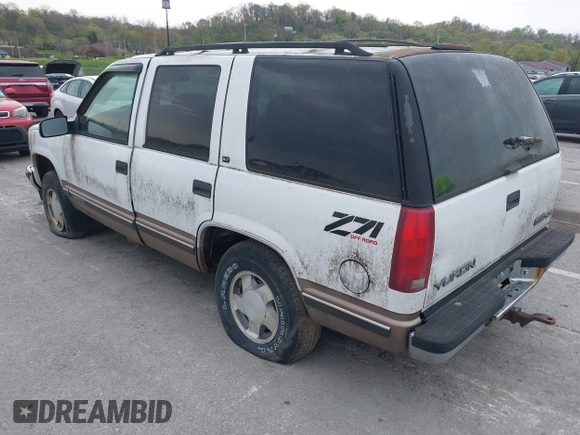 1997 GMC Yukon with VIN 1GKEK13R2VJ739795, listed as a IAAI auction lot 42011678 with 185,306 mi miles. Bid and sale history available at carsss.com. Image 3.