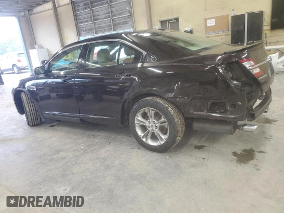 2014 Ford Taurus SEL z VIN 1FAHP2E80EG128686, wystawiony jako Copart lot #57158255 z przebiegiem 69 529 mil mil oraz Szkoda całkowita • Salvage title. Historia ofert i sprzedaży dostępna na DreamBid. Obrazek 2.