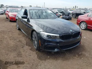 2019 BMW 5 Series 530e iPerformance with VIN WBAJA9C59KB389304, listed as a IAAI auction lot 41562928 with 64,137 mi miles. Bid and sale history available at carsss.com. Image 1.