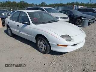 1999 Pontiac Sunfire SE z VIN 1G2JB5247X7575780, wystawiony jako IAAI lot #42143427 z przebiegiem Nie podano mil oraz . Historia ofert i sprzedaży dostępna na DreamBid. Obrazek 1.