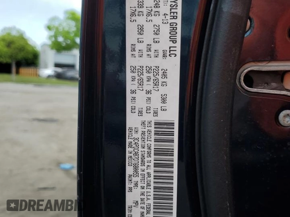 2013 Dodge Journey SE with VIN 3C4PDCAB7DT680055, listed as a Copart auction lot 58241435 with 199,620 mi miles and Salvage title. Bid and sale history available at DreamBid. Image 13.