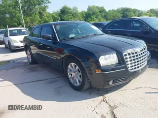 2009 Chrysler 300 Touring with VIN 2C3LA53V49H508404, listed as a IAAI auction lot 42042637 with 171,356 mi miles and . Bid and sale history available at carsss.com. Image 1.