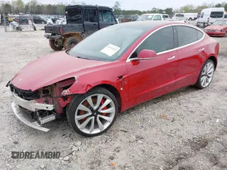 2018 Tesla Model 3 Long Range Battery with VIN 5YJ3E1EB7JF055384, listed as a IAAI auction lot 41924325 with 52,039 mi miles and . Bid and sale history available at DreamBid. Image 2.