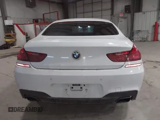 2014 BMW 6 Series 650i xDrive z VIN WBA6B4C55ED371378, wystawiony jako IAAI lot #41640888 z przebiegiem 80 927 mil mil oraz . Historia ofert i sprzedaży dostępna na DreamBid. Obrazek 16.