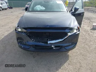 2021 Mazda CX-5 Touring z VIN JM3KFBCMXM0389857, wystawiony jako IAAI lot #42309650 z przebiegiem 49 938 mil mil oraz . Historia ofert i sprzedaży dostępna na DreamBid. Obrazek 6.