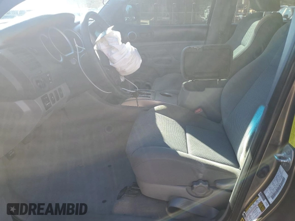 2010 Toyota Tacoma PreRunner with VIN 3TMKU4HN3AM025218, listed as a Copart auction lot 87600035 with 92,605 mi miles and Salvage title. Bid and sale history available at DreamBid. Image 7.