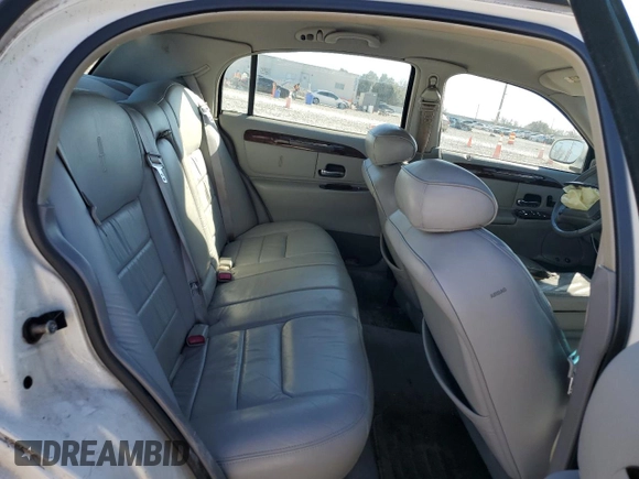 1999 Lincoln Town Car Executive z VIN 1LNHM81W8XY713650, wystawiony jako Copart lot #42335925 z przebiegiem 138 231 mil mil oraz Szkoda całkowita • Salvage title. Historia ofert i sprzedaży dostępna na DreamBid. Obrazek 10.