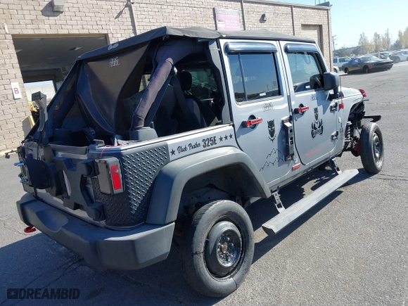 2015 Jeep Wrangler Unlimited Sport with VIN 1C4BJWDG7FL587014, listed as a IAAI auction lot 40641034 with 81,045 mi miles. Bid and sale history available at carsss.com. Image 4.