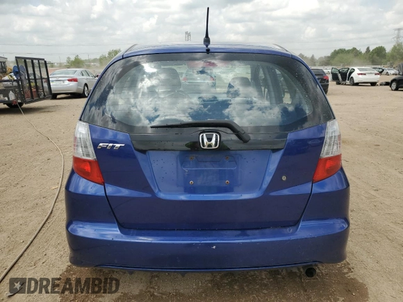 2009 Honda Fit with VIN JHMGE88229S049270, listed as a Copart auction lot 56935235 with 118,649 mi miles and Salvage title. Bid and sale history available at DreamBid. Image 6.