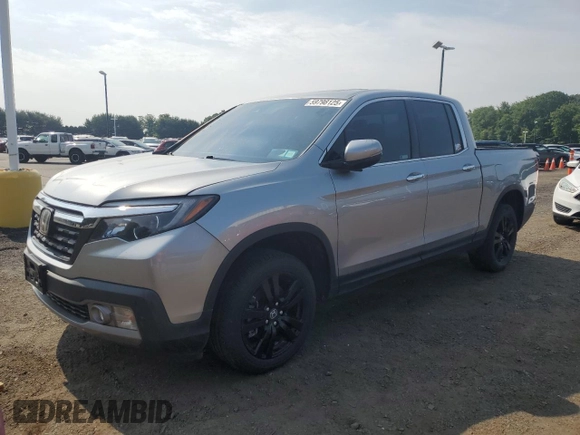 2018 Honda Ridgeline RTL-E with VIN 5FPYK3F77JB014975, listed as a Copart auction lot 59798125 with 124,361 mi miles and Clean title. Bid and sale history available at DreamBid. Image 1.