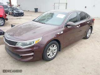 2016 Kia Optima LX with VIN 5XXGT4L30GG075759, listed as a IAAI auction lot 42024856 with 113,740 mi miles. Bid and sale history available at carsss.com. Image 2.
