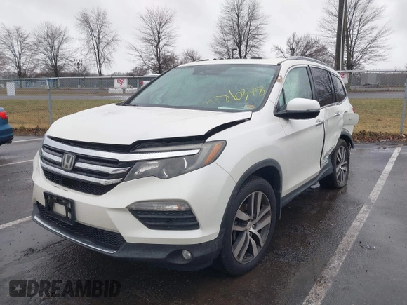 2016 Honda Pilot Touring with VIN 5FNYF6H95GB062089, listed as a IAAI auction lot 41810378 with 74,704 mi miles and . Bid and sale history available at DreamBid. Image 17.