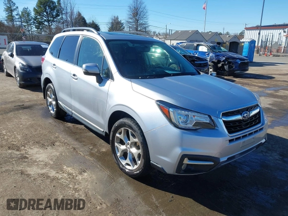 2017 Subaru Forester Touring with VIN JF2SJAWC8HH532348, listed as a IAAI auction lot 41304804 with 104,221 mi miles and . Bid and sale history available at DreamBid. Image 1.