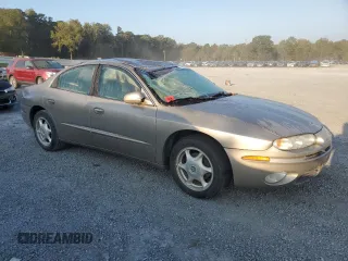 2003 Oldsmobile Aurora z VIN 1G3GS64C434101104, wystawiony jako Copart lot #74995974 z przebiegiem Nie podano mil oraz Szkody całkowita. Historia ofert i sprzedaży dostępna na DreamBid. Obrazek 4.