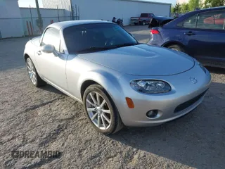 2007 Mazda MX-5 Miata Grand Touring with VIN JM1NC26F470123895, listed as a IAAI auction lot 42101200 with 125,764 mi miles and . Bid and sale history available at DreamBid. Image 1.