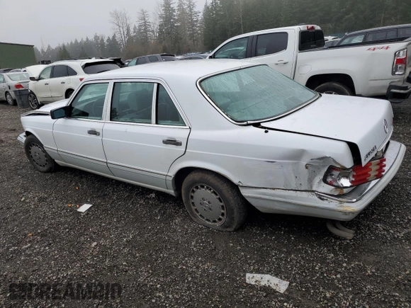 1990 Mercedes-Benz 300 with VIN WDBCA25D9LA550909, listed as a Copart auction lot 82717124 with 221,701 mi miles and Salvage Title. Bid and sale history available at DreamBid. Image 2.