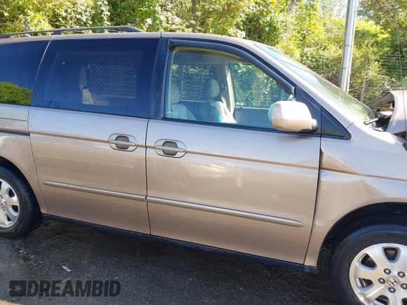 2003 Honda Odyssey EX-L z VIN 5FNRL180X3B055800, wystawiony jako IAAI lot #42053575 z przebiegiem 203 398 mil mil oraz . Historia ofert i sprzedaży dostępna na DreamBid. Obrazek 13.