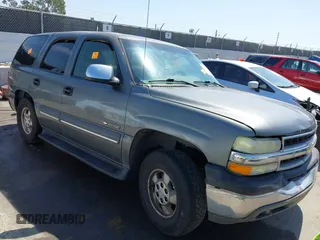 2002 Chevrolet Tahoe LS z VIN 1GNEC13V92R305304, wystawiony jako IAAI lot #41851210 z przebiegiem Nie podano mil oraz . Historia ofert i sprzedaży dostępna na DreamBid. Obrazek 1.