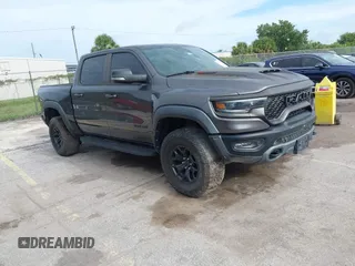 2021 Ram 1500 TRX with VIN 1C6SRFU98MN820577, listed as a IAAI auction lot 42652005 with 43,429 mi miles and . Bid and sale history available at DreamBid. Image 1.