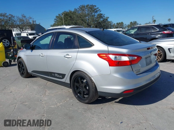 2012 Ford Focus SE with VIN 1FAHP3F23CL265724, listed as a IAAI auction lot 41184121 with 216,873 mi miles. Bid and sale history available at carsss.com. Image 3.
