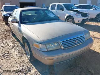 1998 Ford Crown Victoria LX with VIN 2FAFP74W3WX132117, listed as a IAAI auction lot 41738766 with 179,763 mi miles. Bid and sale history available at carsss.com. Image 1.