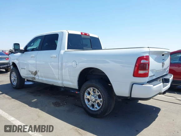 2023 Ram 2500 Laramie with VIN 3C6UR5FL2PG559276, listed as a IAAI auction lot 42281324 with 23,526 mi miles and . Bid and sale history available at DreamBid. Image 3.