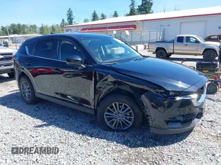 2021 Mazda CX-5 Touring z VIN JM3KFBCM5M0443016, wystawiony jako IAAI lot #42327874 z przebiegiem 34 308 mil mil oraz . Historia ofert i sprzedaży dostępna na DreamBid. Obrazek 1.