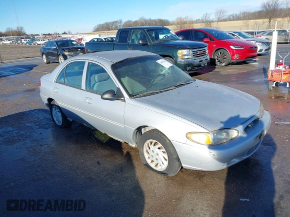 1999 Ford Escort SE z VIN 1FAFP13P8XW185612, wystawiony jako IAAI lot #41097304 z przebiegiem 221 752 mil mil oraz . Historia ofert i sprzedaży dostępna na DreamBid. Obrazek 1.