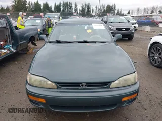 1996 Toyota Camry LE z VIN 4T1EF12K9TU116427, wystawiony jako IAAI lot #38696498 z przebiegiem 242 599 mil mil oraz . Historia ofert i sprzedaży dostępna na DreamBid. Obrazek 11.