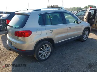 2012 Volkswagen Tiguan SE with VIN WVGBV7AX7CW580259, listed as a IAAI auction lot 42719624 with 94,710 mi miles and . Bid and sale history available at DreamBid. Image 4.