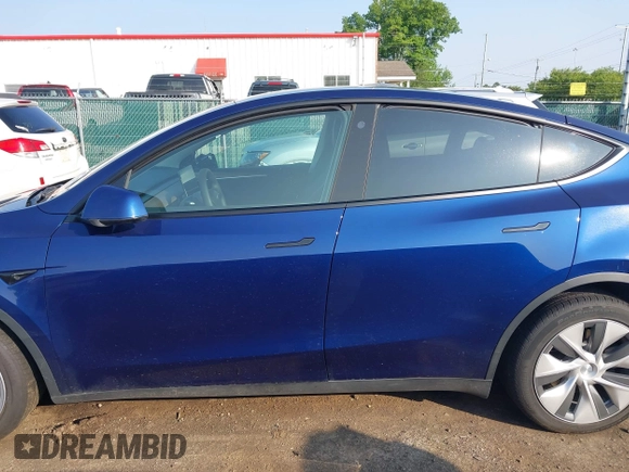 2023 Tesla Model Y Long Range with VIN 7SAYGDEE0PF671726, listed as a IAAI auction lot 42393616 with Not provided miles and . Bid and sale history available at DreamBid. Image 14.