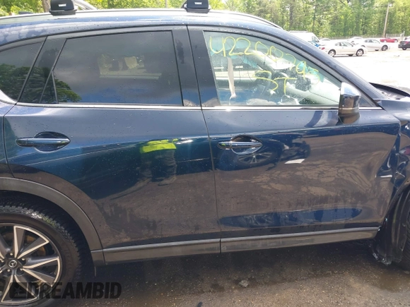 2018 Mazda CX-5 Grand Touring with VIN JM3KFBDM2J0373386, listed as a IAAI auction lot 42200795 with 70,111 mi miles and . Bid and sale history available at DreamBid. Image 14.