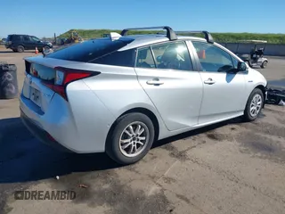 2021 Toyota Prius L Eco with VIN JTDKAMFU5M3130478, listed as a IAAI auction lot 41867606 with 52,223 mi miles. Bid and sale history available at carsss.com. Image 4.
