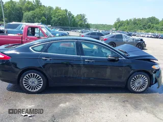 2016 Ford Fusion Titanium z VIN 3FA6P0K97GR174228, wystawiony jako IAAI lot #42636326 z przebiegiem 110 288 mil mil oraz . Historia ofert i sprzedaży dostępna na DreamBid. Obrazek 13.