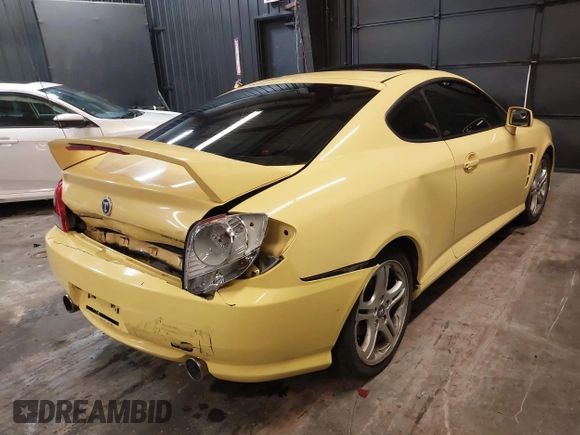 2006 Hyundai Tiburon GT z VIN KMHHN65F56U225936, wystawiony jako IAAI lot #41695280 z przebiegiem 121 110 mil mil oraz . Historia ofert i sprzedaży dostępna na DreamBid. Obrazek 4.