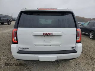 2019 GMC Yukon SLT with VIN 1GKS2BKC2KR338007, listed as a Copart auction lot 82336394 with 105,087 mi miles and Salvage Title. Bid and sale history available at carsss.com. Image 6.