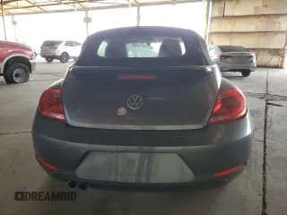2016 Volkswagen Beetle Denim с VIN 3VW507AT8GM802601, выставлен на аукционе Copart как лот 60335415 с пробегом 71 163 миль миль и Списание • Salvage title. История ставок и продаж доступна на DreamBid. Изображение 6.