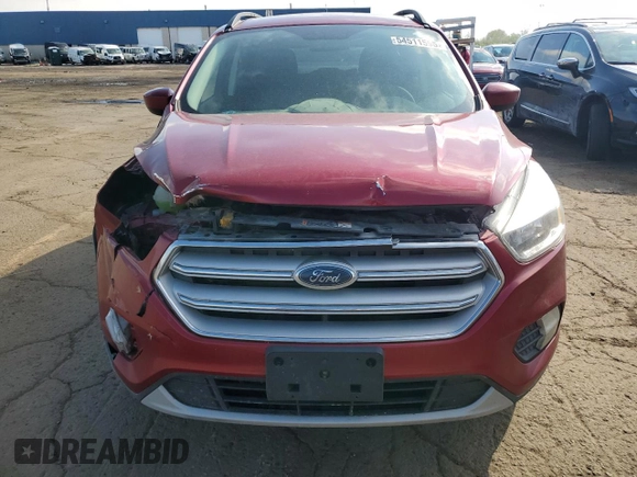 2018 Ford Escape SE z VIN 1FMCU9GD0JUC29279, wystawiony jako Copart lot #54511595 z przebiegiem 77 547 mil mil oraz Czysty tytuł • Clean title. Historia ofert i sprzedaży dostępna na DreamBid. Obrazek 5.